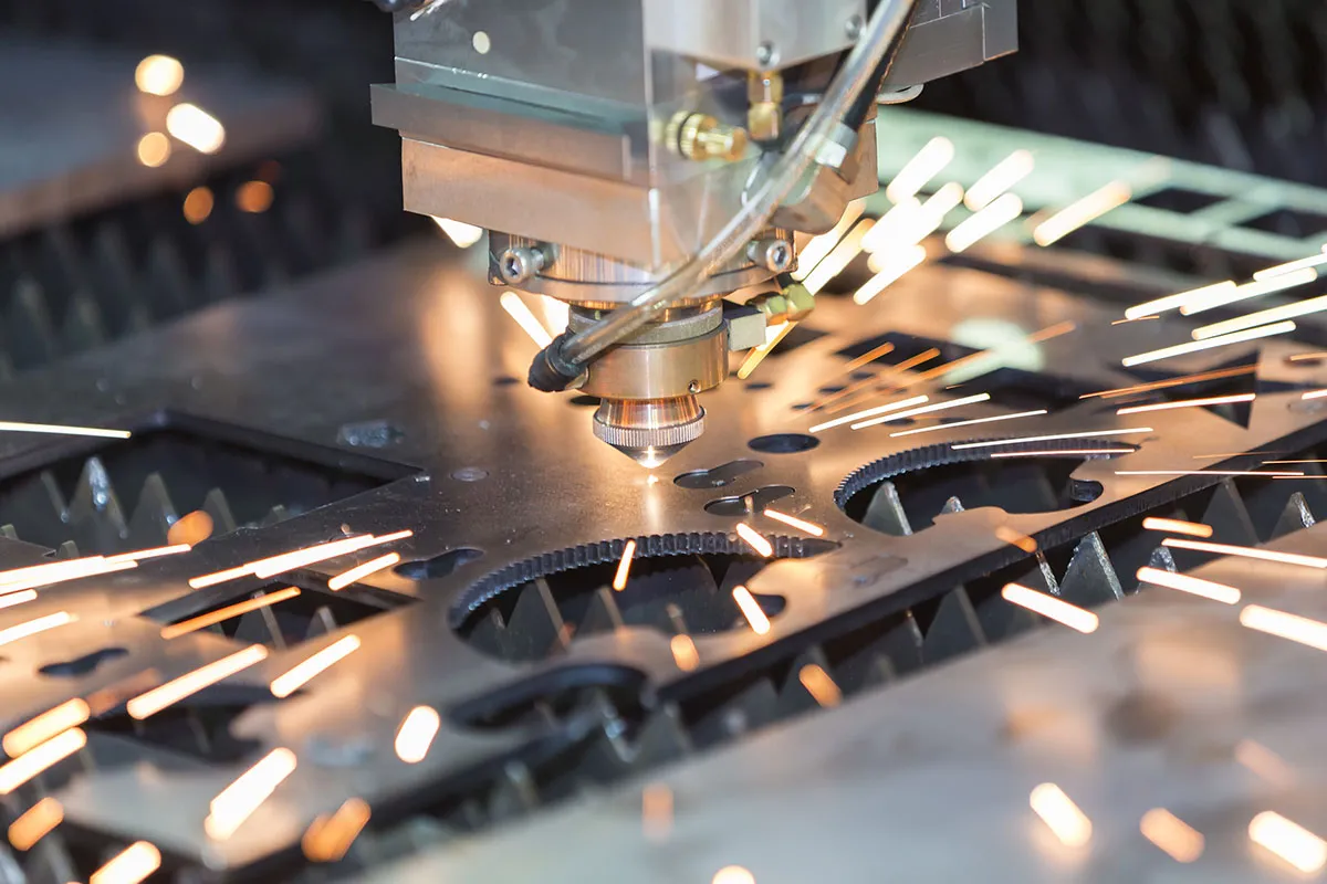 Laser cutting sheet steel, sparks flying