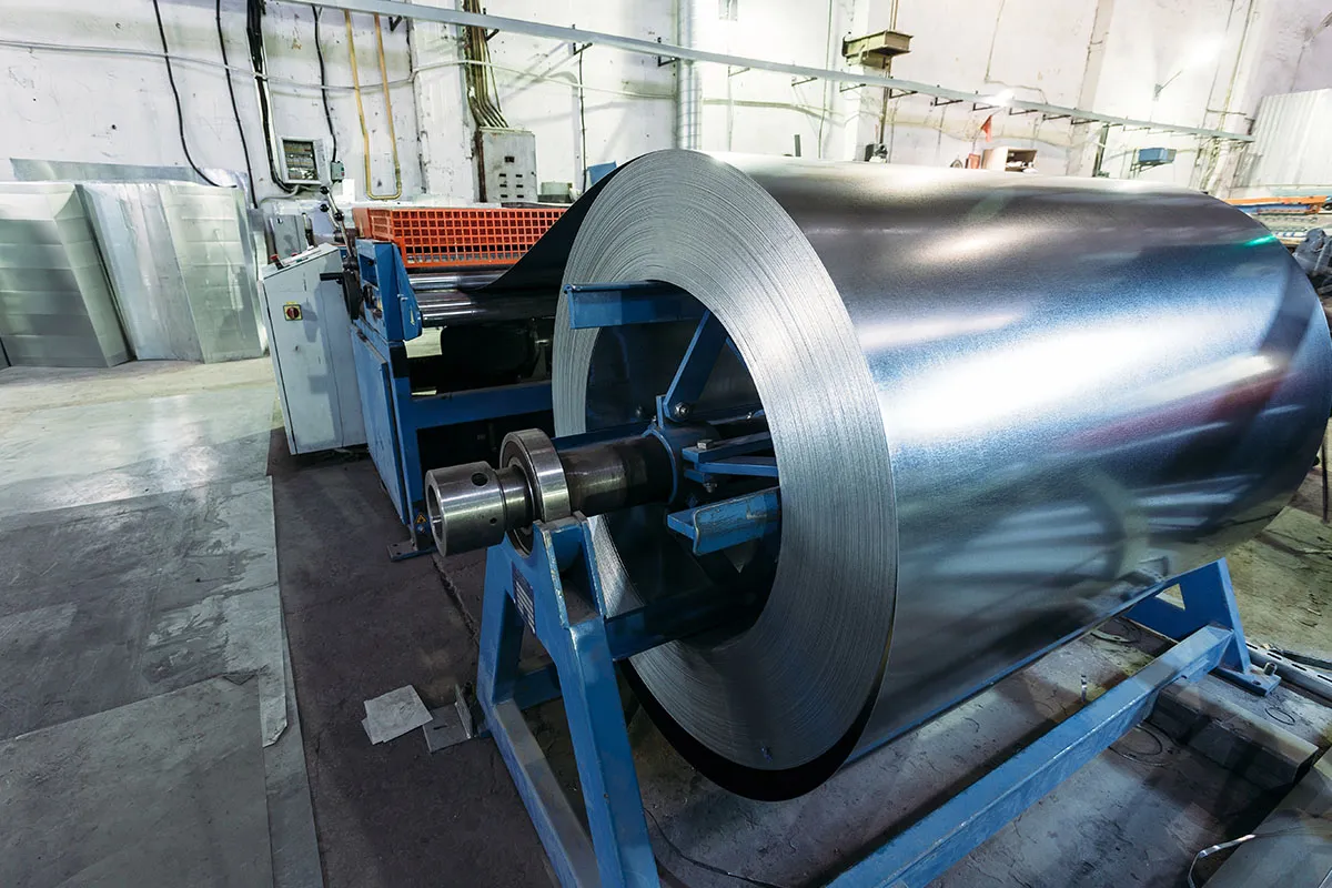 Coil of galvanised sheet steel on an uncoiler