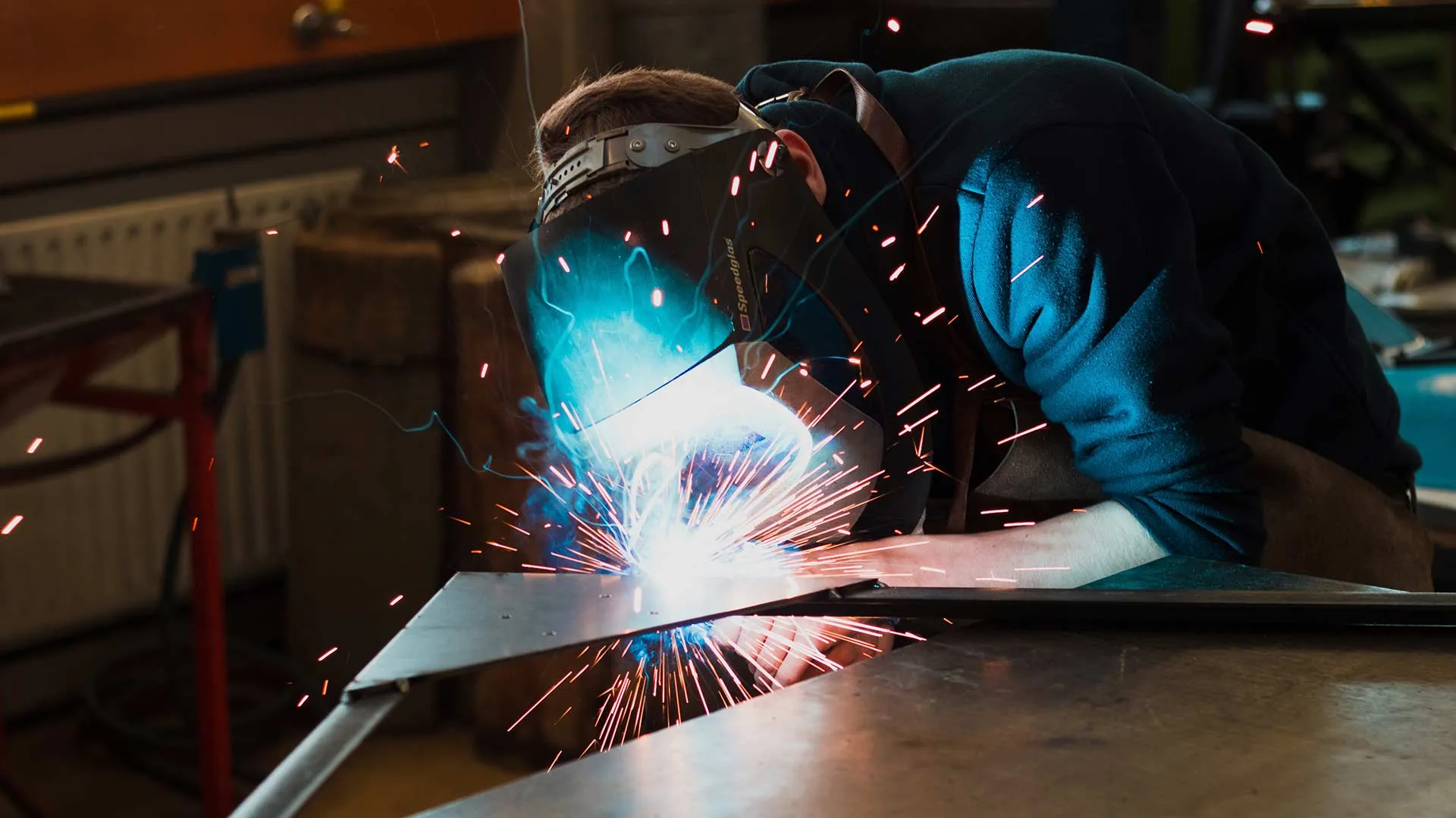 Welder at work, sparks flying